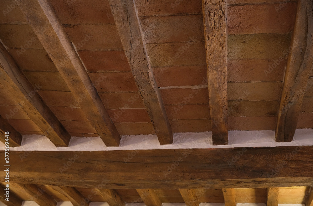 ceiling in exposed wooden beams and terracotta