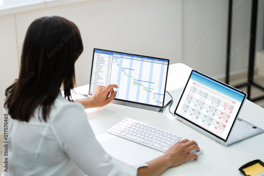 Employee Working On Calendar Schedule Employee Working On Calendar Schedule