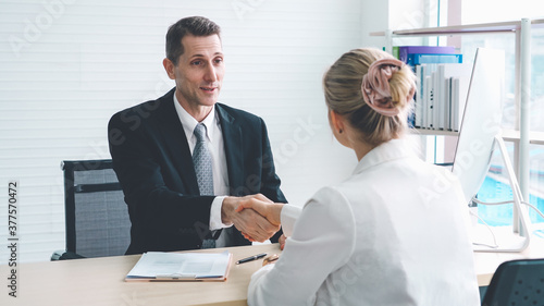 Obraz na płótnie Job seeker and manager handshake in job interview meeting at corporate office
