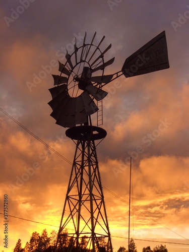 windmill at sunset with clouds