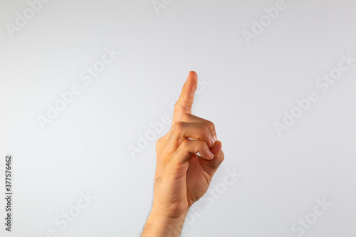 close up of a man s hand communicating with sign language  letters of the alphabet  on a white background