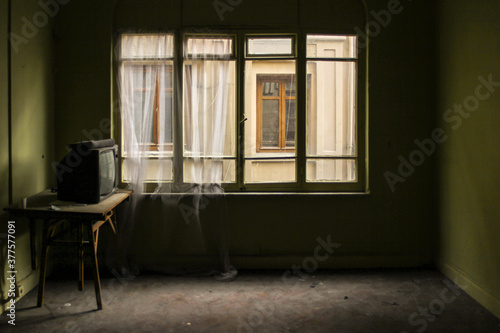 Abandoned house with a television set inside