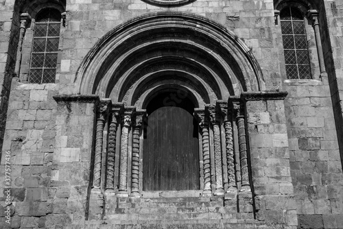 COIMBRA, PORTUGAL - summer 2019: Medieval Church of Santiago in Coimbra, Centro region, Portugal. black and white