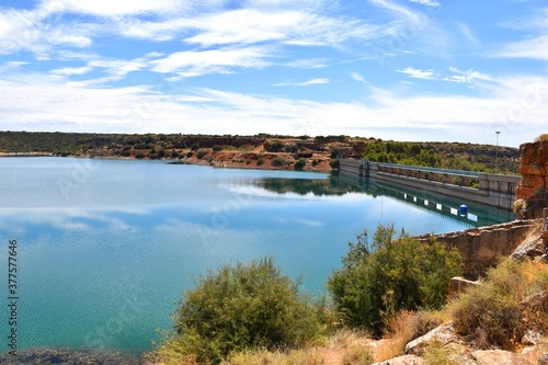 Waters of the Peñarroya reservoir and dam of the dam, Ruidera lagoons.