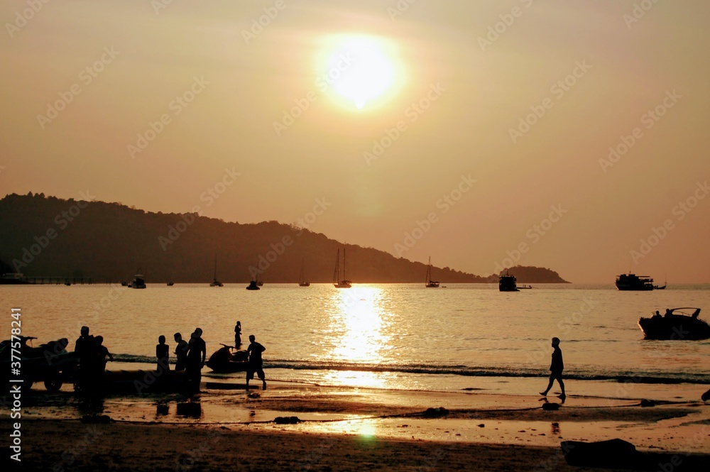 Reflection of the sunset on Patong beach , Phuket, Thailand
