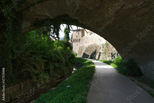 passage under the arch in the village of umbertide umbria italy