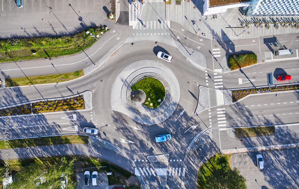 Aerial view of the roundabout. The cars moving on the roundabout. Espoo, Finland.