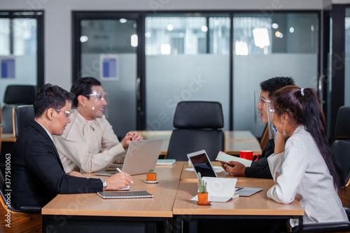 asian Businesspeople discussing together in conference room during meeting at office. business people conference in modern meeting room