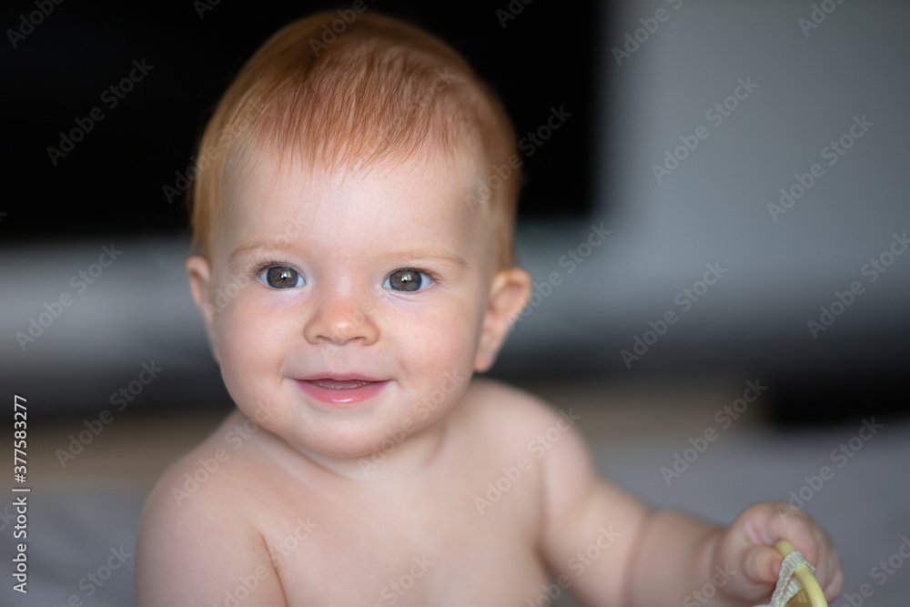 Baby 6 months looks into the camera and smiles Baby 6 months looks into the camera and smiles