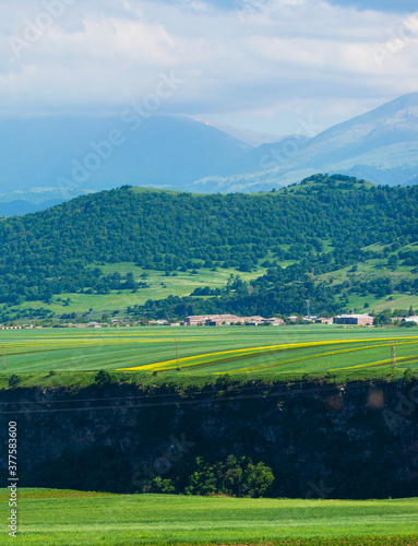Beautiful landscape with village  field and mountains  Armenia