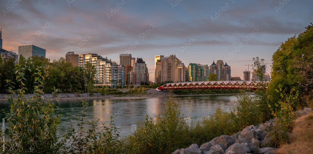 View of pedestrian bridge over the Bow River in Calgary Alberta at sunrise. 