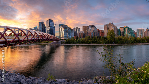 View of pedestrian bridge over the Bow River in Calgary Alberta at sunrise. 