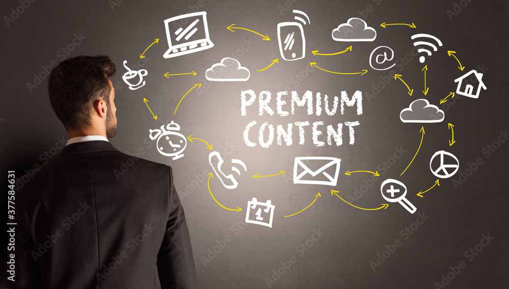 businessman drawing social media icons with PREMIUM CONTENT inscription, new media concept businessman drawing social media icons with PREMIUM CONTENT inscription, new media concept