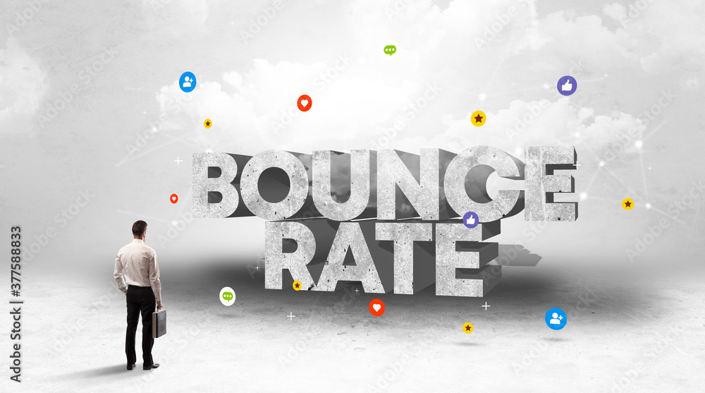 Young businessman standing in front of BOUNCE RATE inscription, social media concept Young businessman standing in front of BOUNCE RATE inscription, social media concept