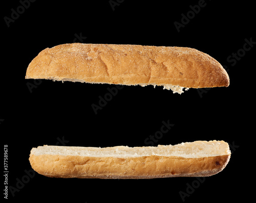 Papier peint halved baked ciabatta loaf isolated on black background, sandwich blank
