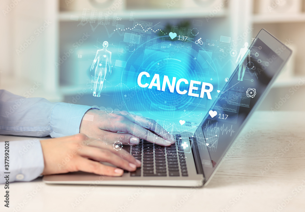 Doctor working a health check with CANCER inscription, recording medical test results Doctor working a health check with CANCER inscription, recording medical test results