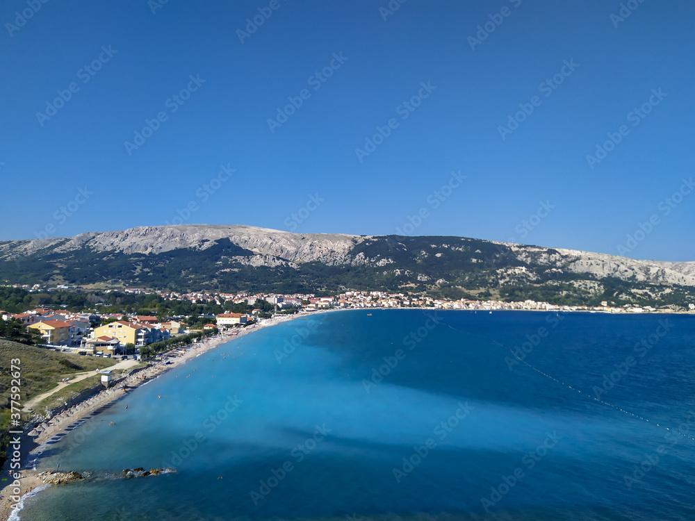view on Baska on island Krk and its famous pebble beach in Croatia