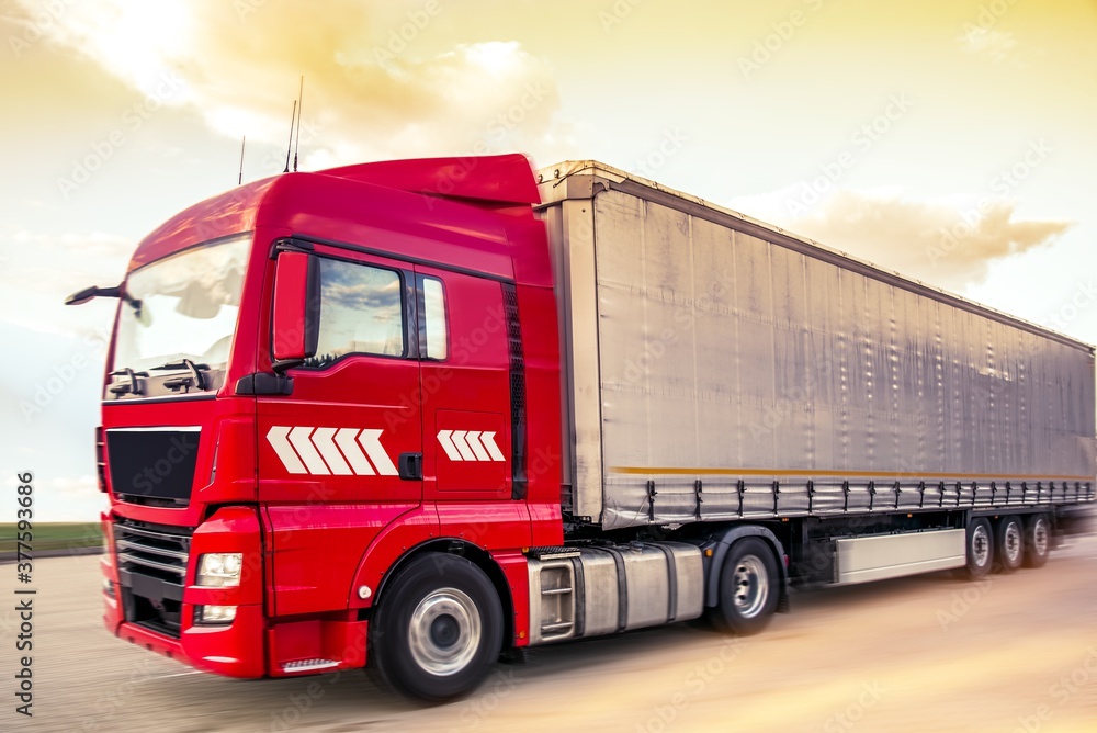 Motion blurred trucks on highway. Transportation