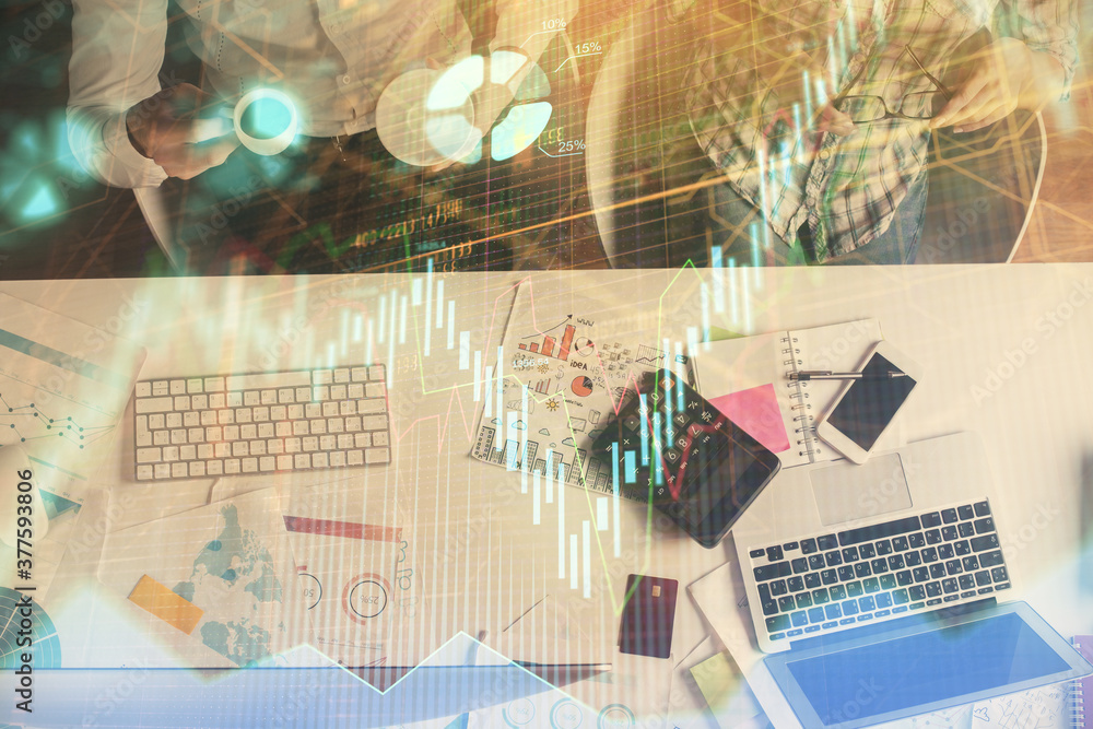 Double exposure of man and woman working together and financial chart hologram drawing. market analysis concept. Computer background. Top View. Double exposure of man and woman working together and financial chart hologram drawing. market analysis concept. Computer background. Top View.
