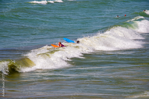 Surf rolling to a lake shore