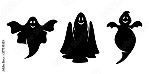 Set of three vector black silhouettes of smiling ghosts isolated on a white background. Halloween elements.