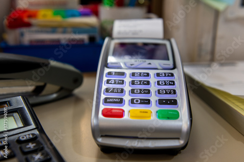 A card reader on a sales counter.