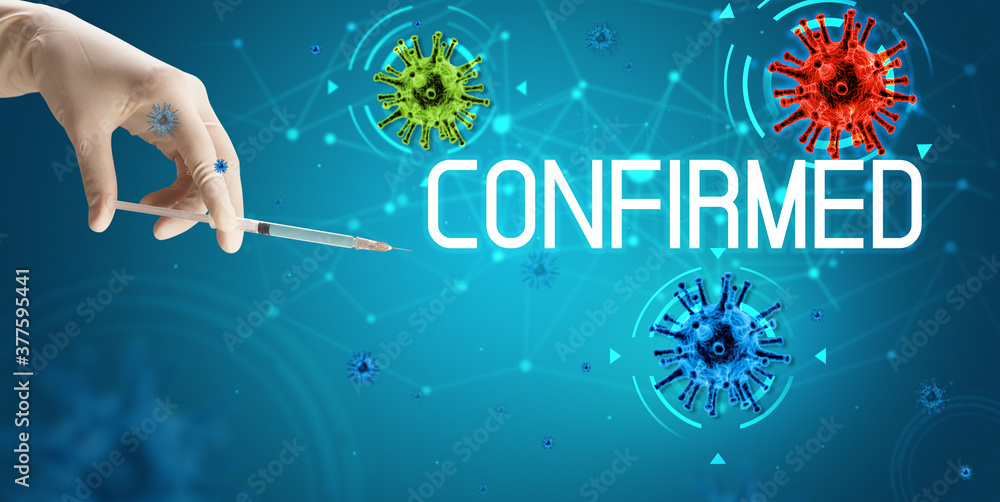 Syringe, medical injection in hand with CONFIRMED inscription, coronavirus vaccine concept