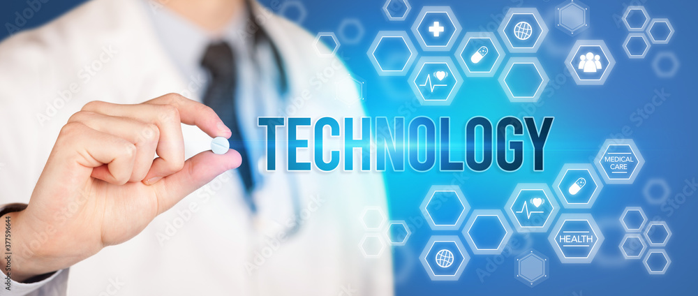Close-up of a doctor giving you a pill with TECHNOLOGY inscription, medical concept Close-up of a doctor giving you a pill with TECHNOLOGY inscription, medical concept