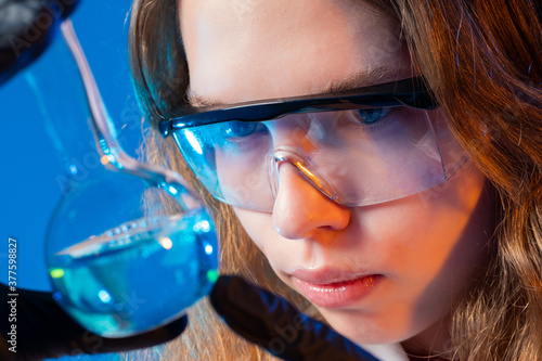 Girl with a flask. The chem...