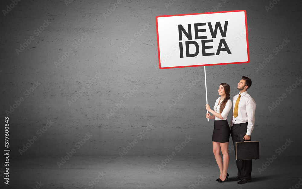 business person holding a traffic sign with NEW IDEA inscription, new idea concept business person holding a traffic sign with NEW IDEA inscription, new idea concept