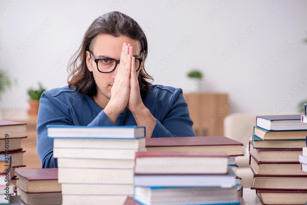 Young male student preparing for exams at home Young male student preparing for exams at home