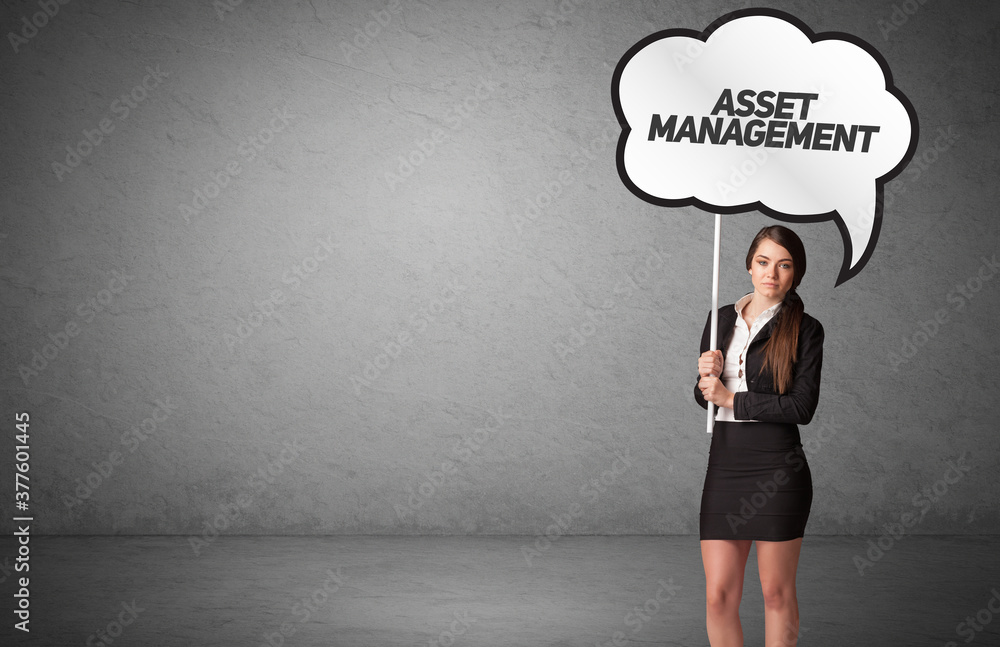 Young business person in casual holding road sign with ASSET MANAGEMENT inscription, new business idea concept Young business person in casual holding road sign with ASSET MANAGEMENT inscription, new business idea concept