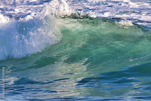 Beautiful aquamarine wave captured at the peak of its break.
