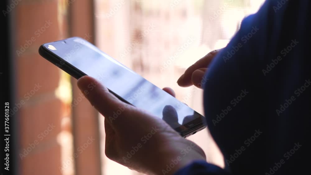 woman's hands typing on smartphone swiping keyboard woman's hands typing on smartphone swiping keyboard