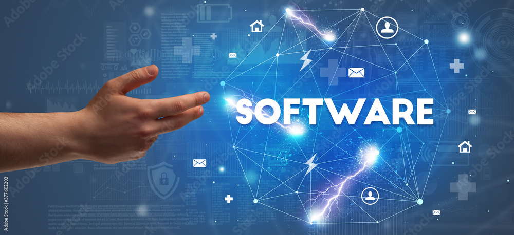 Hand pointing at SOFTWARE inscription, modern technology concept Hand pointing at SOFTWARE inscription, modern technology concept