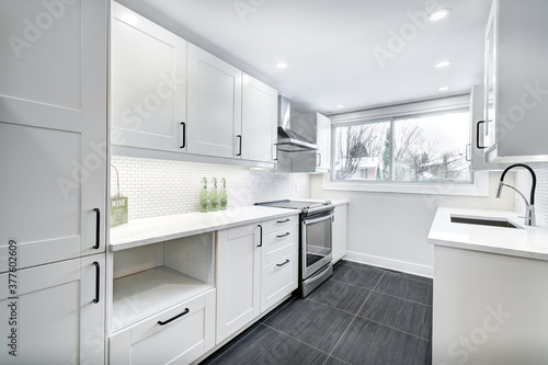 Real Estate Photography - Renovated furnished for sale house in Montreal's suburb with bathroom, basement and new kitchen 