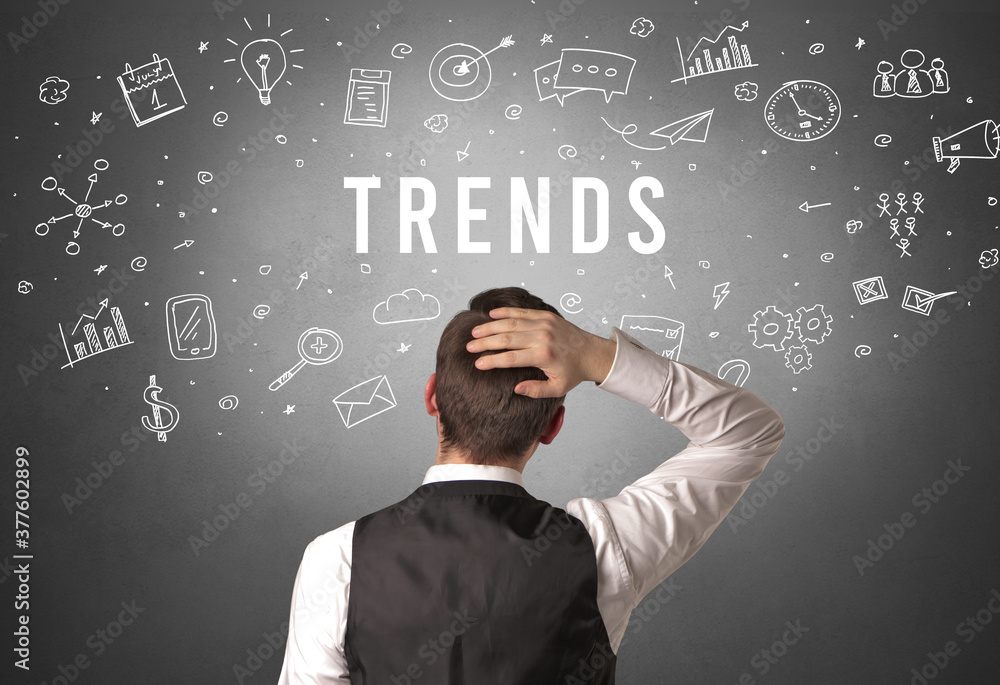Rear view of a businessman with TRENDS inscription, modern business concept Rear view of a businessman with TRENDS inscription, modern business concept