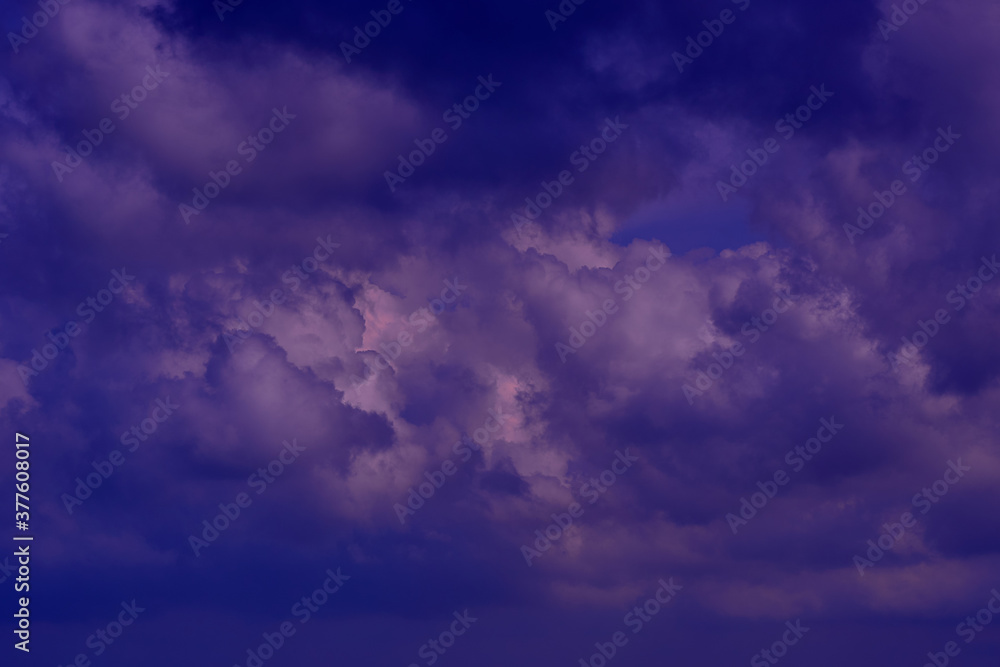 Clouds in the night sky lighted by the moon. Abstract nature bac