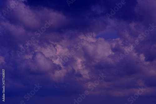 Clouds in the night sky lighted by the moon. Abstract nature bac