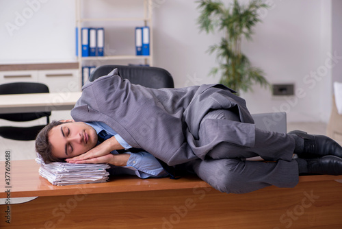 Young male employee sleeping in the office © Elnur