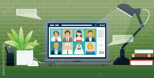 Workers use laptops to communicate via the Internet.