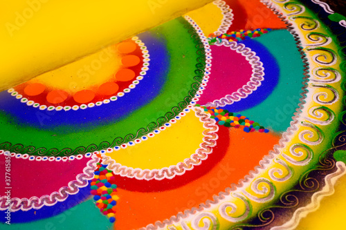 Bright and colorful Indian traditional rangoli decoration photo