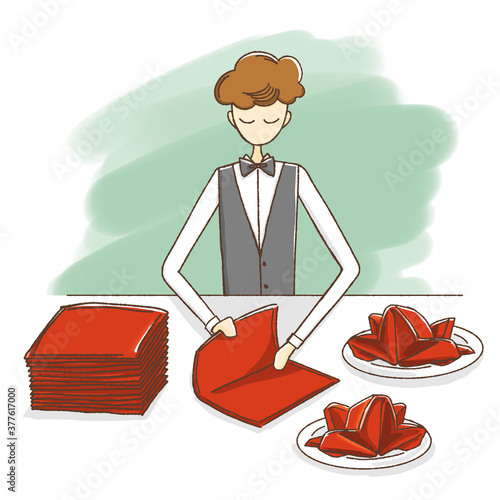 A waiter folding napkin in restaurant