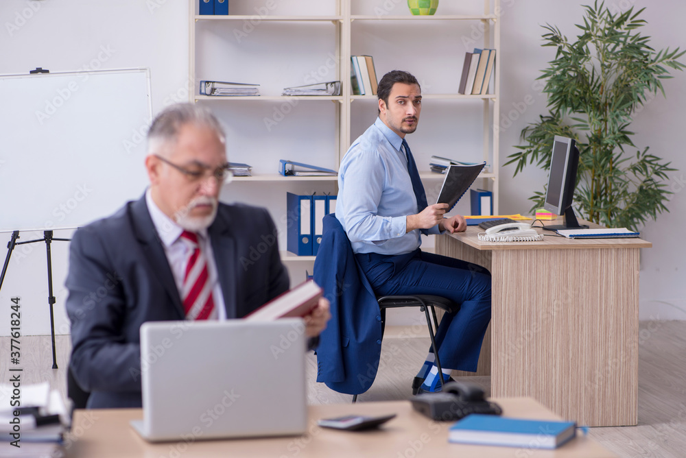 Two employees in the office Two employees in the office