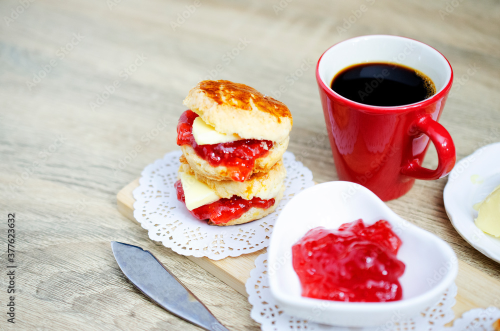 Close up of Tasty Scone homemade for coffee break on wooden table backgrounds Close up of Tasty Scone homemade for coffee break on wooden table backgrounds