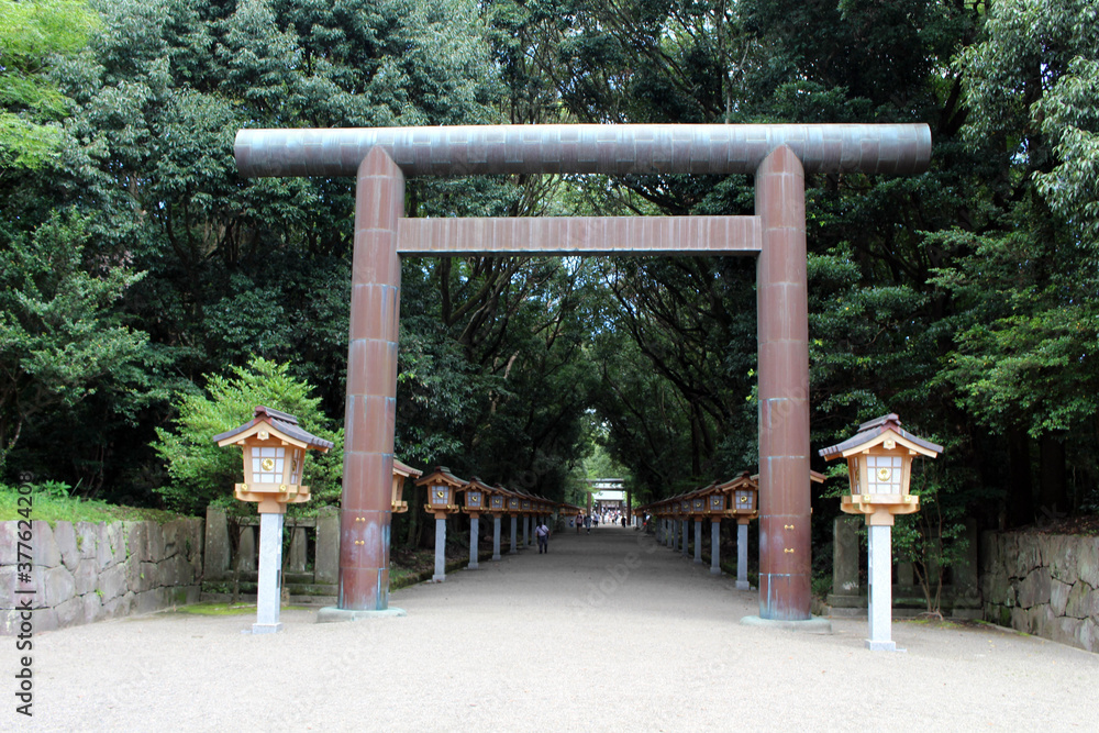Torii Shinto gate and toro lighting equipment of Miyazaki Jingu Shrine. Torii Shinto gate and toro lighting equipment of Miyazaki Jingu Shrine.
