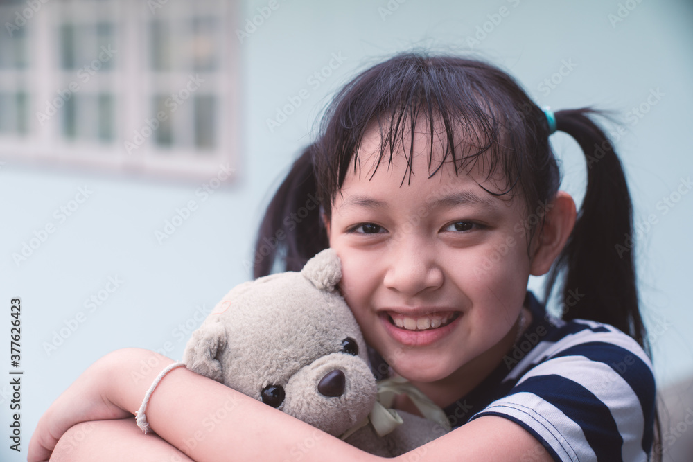 Smile little child girl hugging teddy bear with love Smile little child girl hugging teddy bear with love