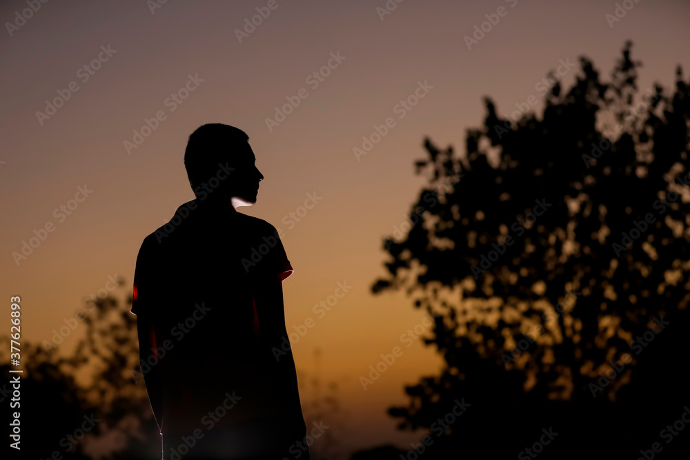 child silhouette on sunset background child silhouette on sunset background