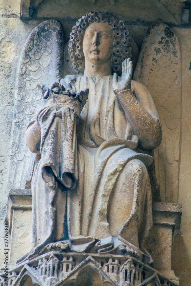 Fototapeta premium View of the exterior facade of the Roman Catholic Notre Dame de Reims Cathedral, a historical monument in the Grand Est region of France and one of the oldest in Europe 