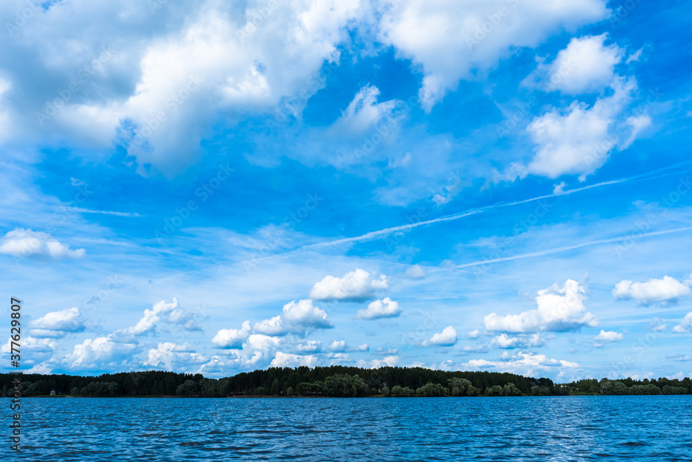 Blue sky and water and white clouds